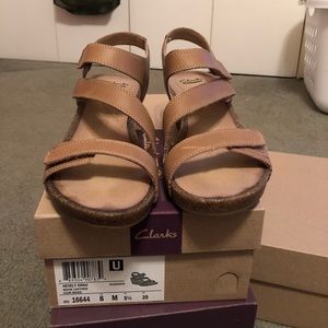Strapping tan wedges by Clark’s